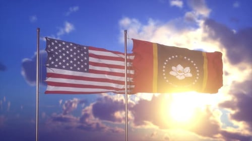 American and Mississippi State Flags Waving in Sunny Sky