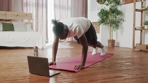 Young Adult Working Out at Home