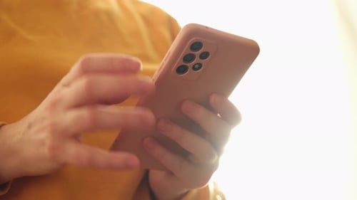 Person Using Smartphone Device Indoors, Close Up