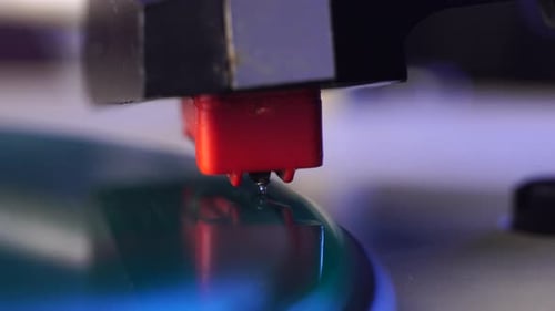 Close Up, Placing Crystal Needle on Spinning Green Vinyl Record