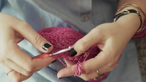 Young Woman Knitting With Crochet 2