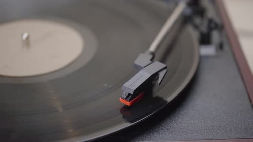 Close up of a needle Vinyl Record player Spinning.