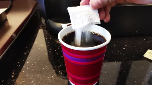 Adding Sugar to a Coffee Cup, Close Up