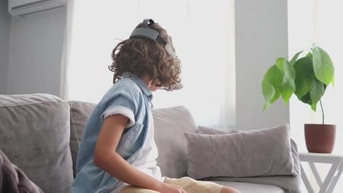 Teen Boy Using Virtual Reality Headset at Home