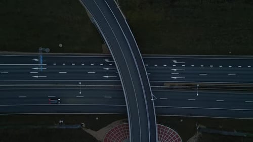This is an Aerial View of a Highway Interchange Captured During the Beautiful Twilight Hours of the