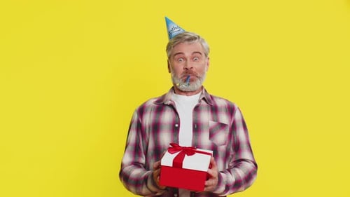Happy Mature Man Surprise Gift Moment Party Cone Hat Joyful Shock Red Bow Birthday Excitement