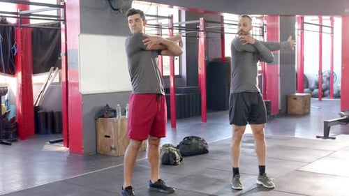 Diverse men at start stretching shoulders then stretching triceps then stretching sides