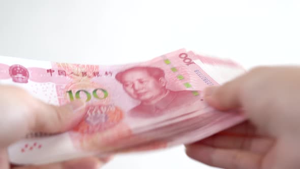 Close up of female hands counting numbers of hundred RMB Chinese paper ...