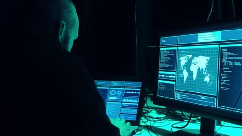 Wanted Hackers Coding Virus Ransomware Using Laptops and Computers in the Basement Cyber Attack