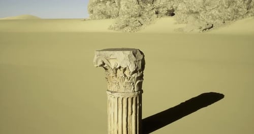 Ancient Column Stands Alone in Vast Desert Landscape Under Clear Sky
