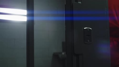 Man in Orange Jumpsuit Walks Into Jail Cell