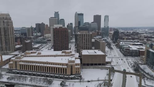 Minneapolis skyline with snowy riverfront and bridge