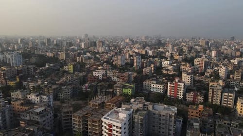 Aerial view of a south Asian city with dense building. Top Establishing drone flight forward shot