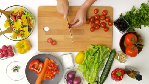 Preparing fresh salad with vegetables, overhead shot