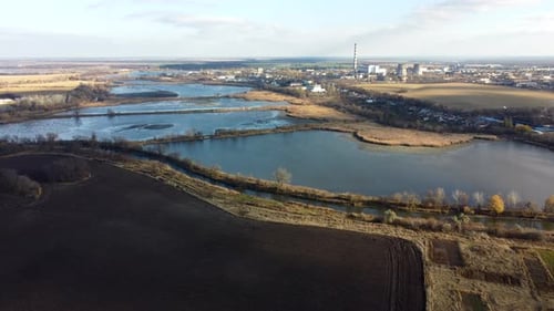 Flying View of Lakes and Industrial Area in the City on an Autumn Day Landscape