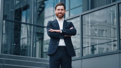 Successful Confident Caucasian Bearded Businessman in Suit Standing Outdoors on Background Office