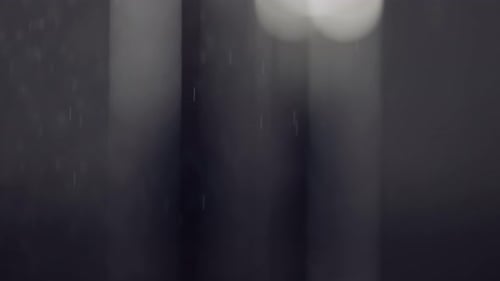 Water droplet mist with grey light bokeh blurred background of atmospheric air