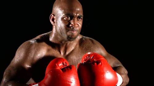 Boxer Punching Gloves Together In