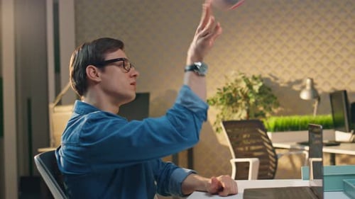 Happy Young Adults Collaborating on Video Call in Office