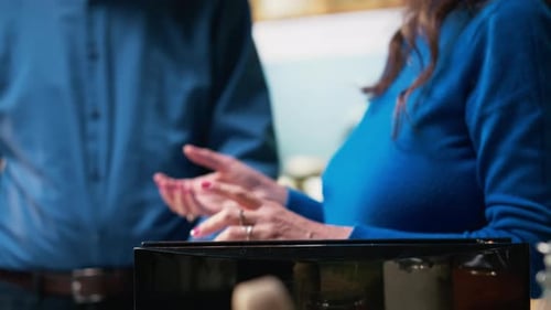 Couple Making Toast Together in Kitchen