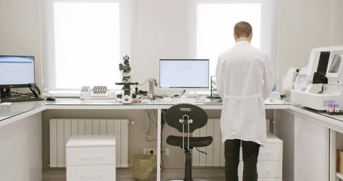 Scientist Working in Clean Modern Laboratory