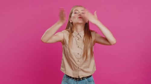 Smiling Woman Sending Lots of Air Kisses Looking at Camera and Smiling Missing you Love Confession