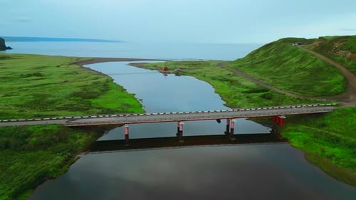Summer Aerial View of the Narrow River Flowing Into the Sea Clip Concrete Bridge Crossing Calm River