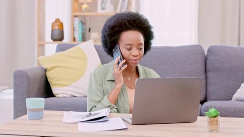 Woman Working at Home on Laptop and Phone