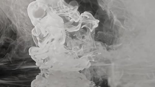 Abstract White Paint Flowing in Black Water