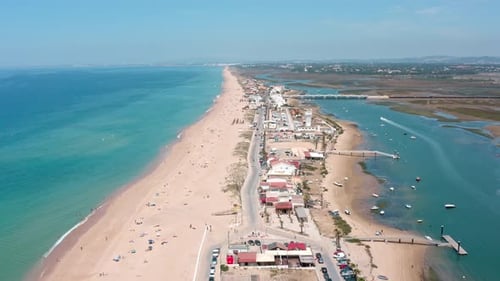 Beautiful Aerial Perspective Showcasing Faro Beach Its Sandy Shores Crystal Clear Turquoise Waters