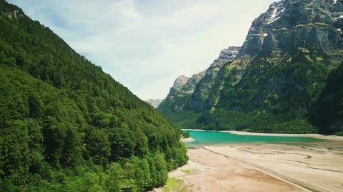 Canyon between mountains with beautiful lake with calm turquoise water