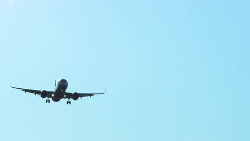 Airplane Coming in for a Landing on Clear Day