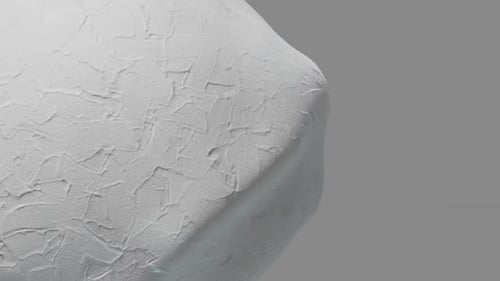 Close-up of a rough stucco surface in motion.