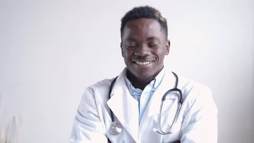 Smiling Doctor Wearing Stethoscope and White Coat
