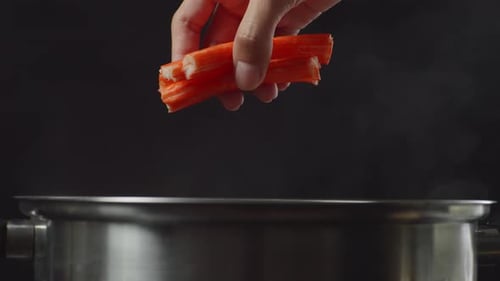 Crab Meat Added to Stainless Steel Cooking Pot