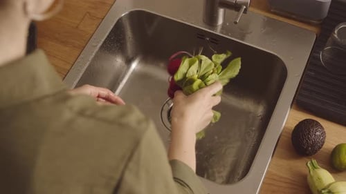 Woman Washing Vegetables