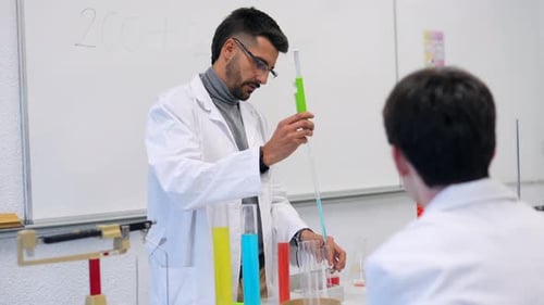 Chemistry Teacher Performing Experiment for Students in Laboratory