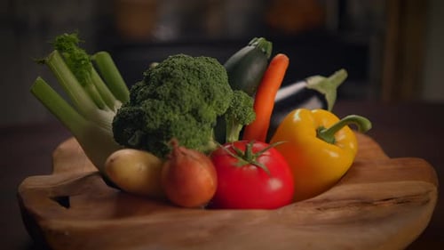 Fresh vegetables in wooden bowl on table