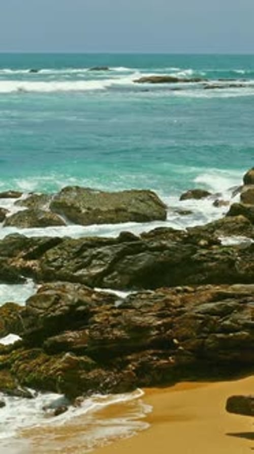 Tropical ocean waves and rocks