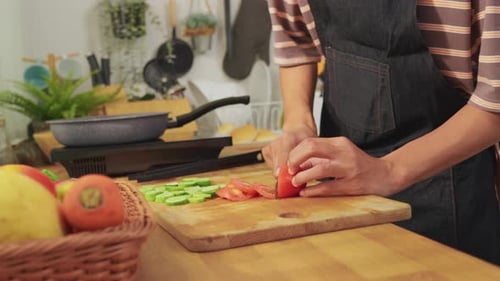 Close up of man cooking healthy food in kitchen in the morning at home.