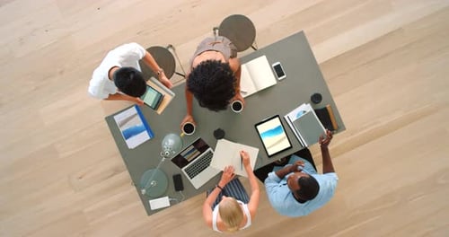 Diverse Team Collaborating at a Table, Birds Eye View
