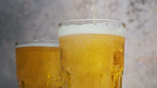 Beer Pouring into Glass Close Up