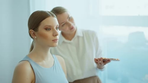 Makeup Artist Work in Her Beauty Studio Portrait of Woman Applying By Professional Make Up Master