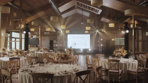 A Beautifully Decorated Room for a Wedding Reception with Elegant Tables Decorated Banquet Hall