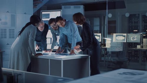 Team Collaborating on a Touchscreen Table in Lab
