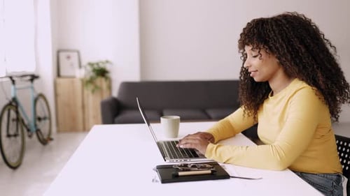 Young Businesswoman Working on Laptop From Home Office
