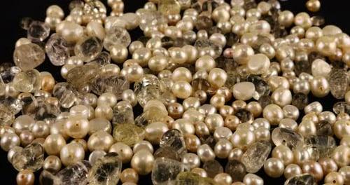 Natural pearls, quartz, rock crystal on black velvet.