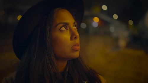 Stylish Woman with Camera at Night