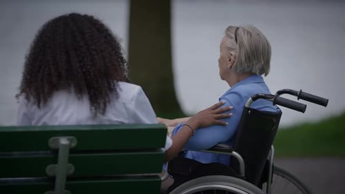 A Caregiver and Patient Enjoying a Cherished Moment Together in the Peaceful Park Setting