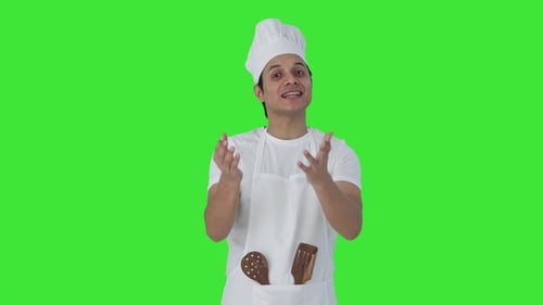 Happy Indian professional talking to someone Green screen